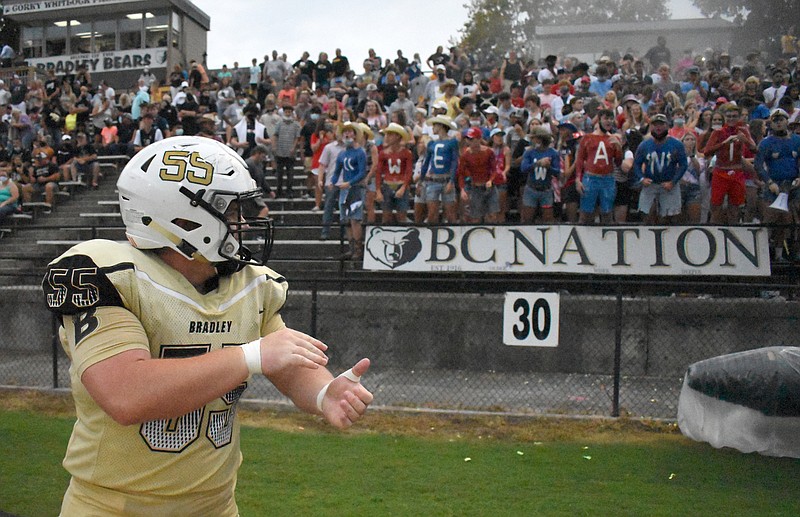 Staff Photo by Matt Hamilton / Bradley Central football player Hunter Callihan cheers with the student section before the start of Thursday night's home game against intracounty rival Walker Valley.