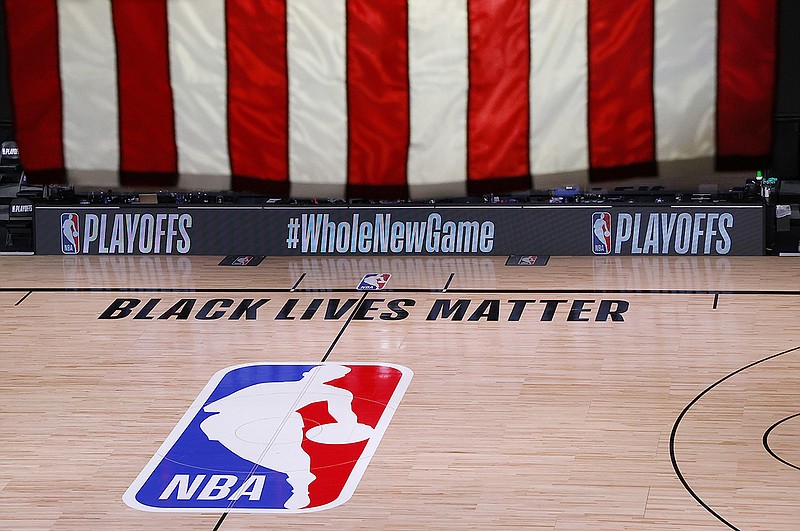 AP photo by Kevin C. Cox / The court is empty after the scheduled tipoff time for an NBA playoff game Wednesday in Lake Buena Vista, Fla. All three postseason games that day were called off as players elected to sit out, and three more were postponed Thursday.
