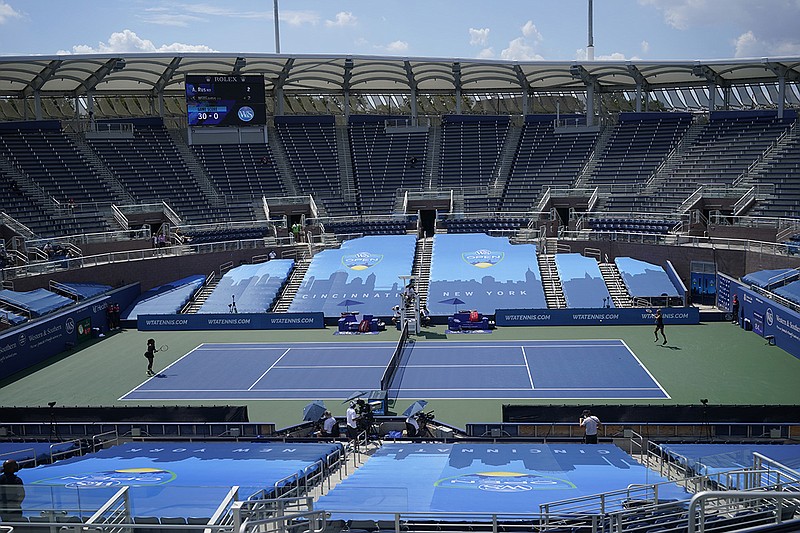 AP photo by Frank Franklin II / Arantxa Rus, right, returns a shot from Serena Williams during a match at the Western & Southern Open on Monday in New York.