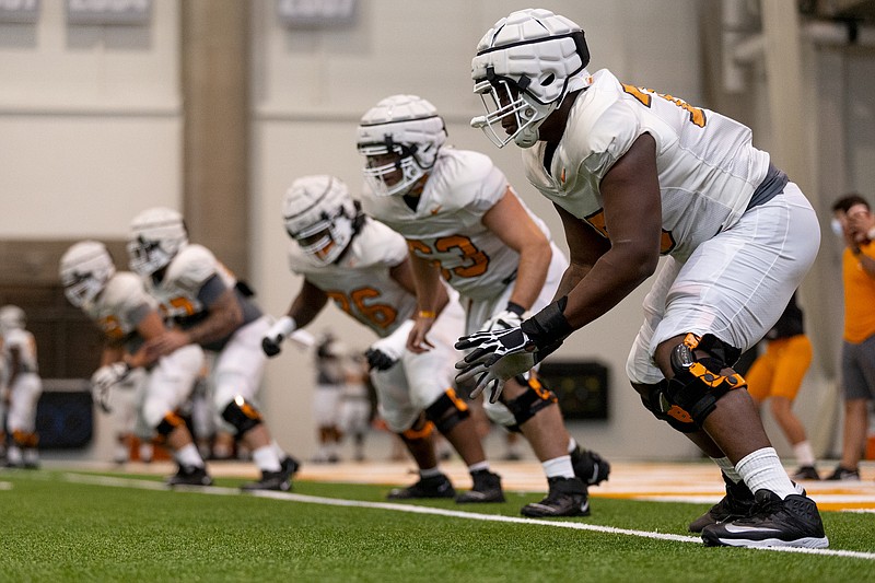 Tennessee Athletics photo by Andrew Ferguson / The Tennessee Volunteers, shown here during Tuesday's indoor practice at the Anderson Training Center, took Friday off from workouts following multiple positive COVID tests.