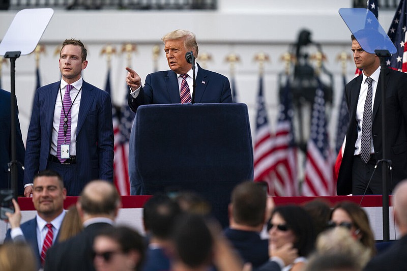 President Donald Trump talks with Deputy Campaign Manager for Presidential Operations Max Miller, left, and director of the Presidential Personnel Office John McEntee, right, before his speech to the Republican National Convention on the South Lawn of the White House, Thursday, Aug. 27, 2020, in Washington. (AP Photo/Evan Vucci)


