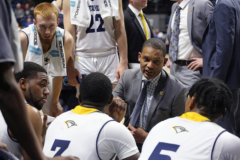 Staff photo / UTC men's basketball coach Lamont Paris talks to his players during a timeout in the Mocs' home game against Mercer on Dec. 17, 2019.