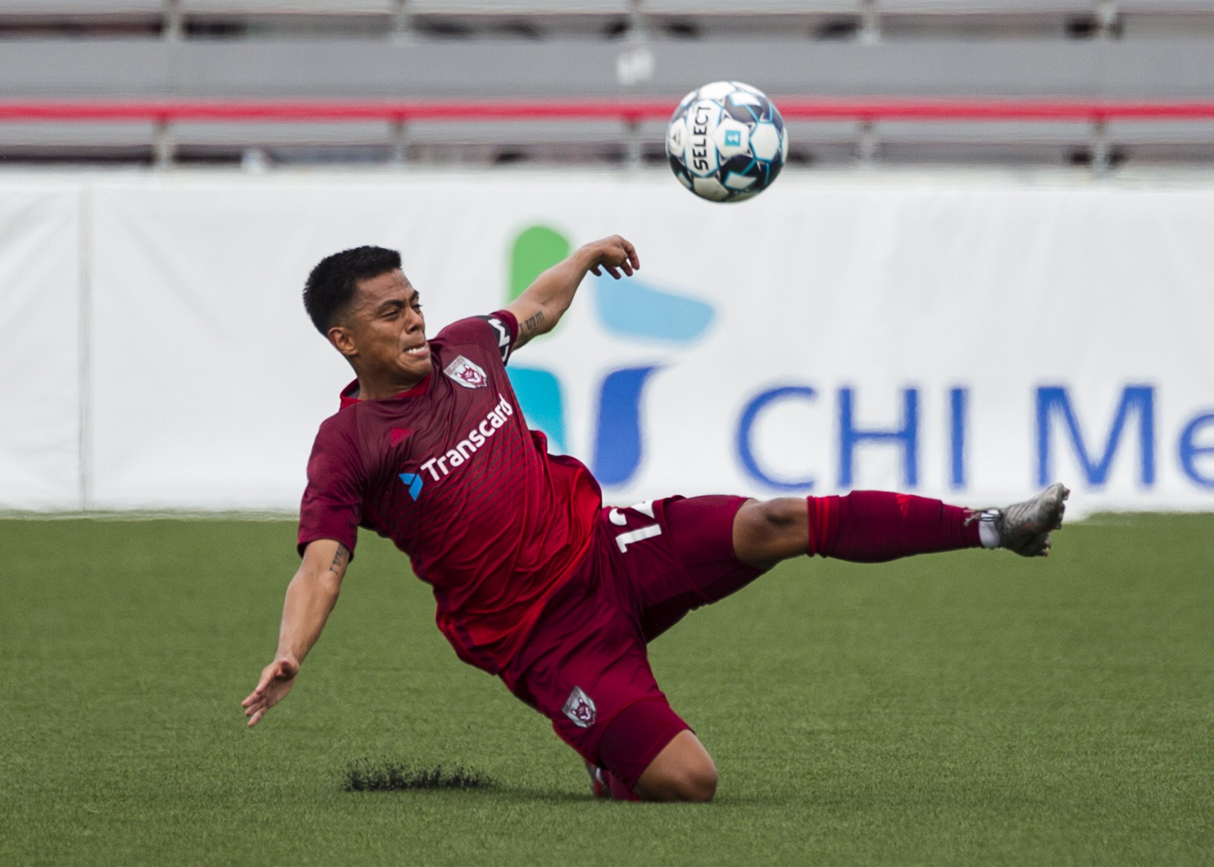 Staff photo by Troy Stolt / Chattanooga defender Ricky Ruiz makes a sliding interception during the Red Wolves' 4-0 victory against the New England Revolution II on Saturday at CHI Memorial Stadium in East Ridge.
