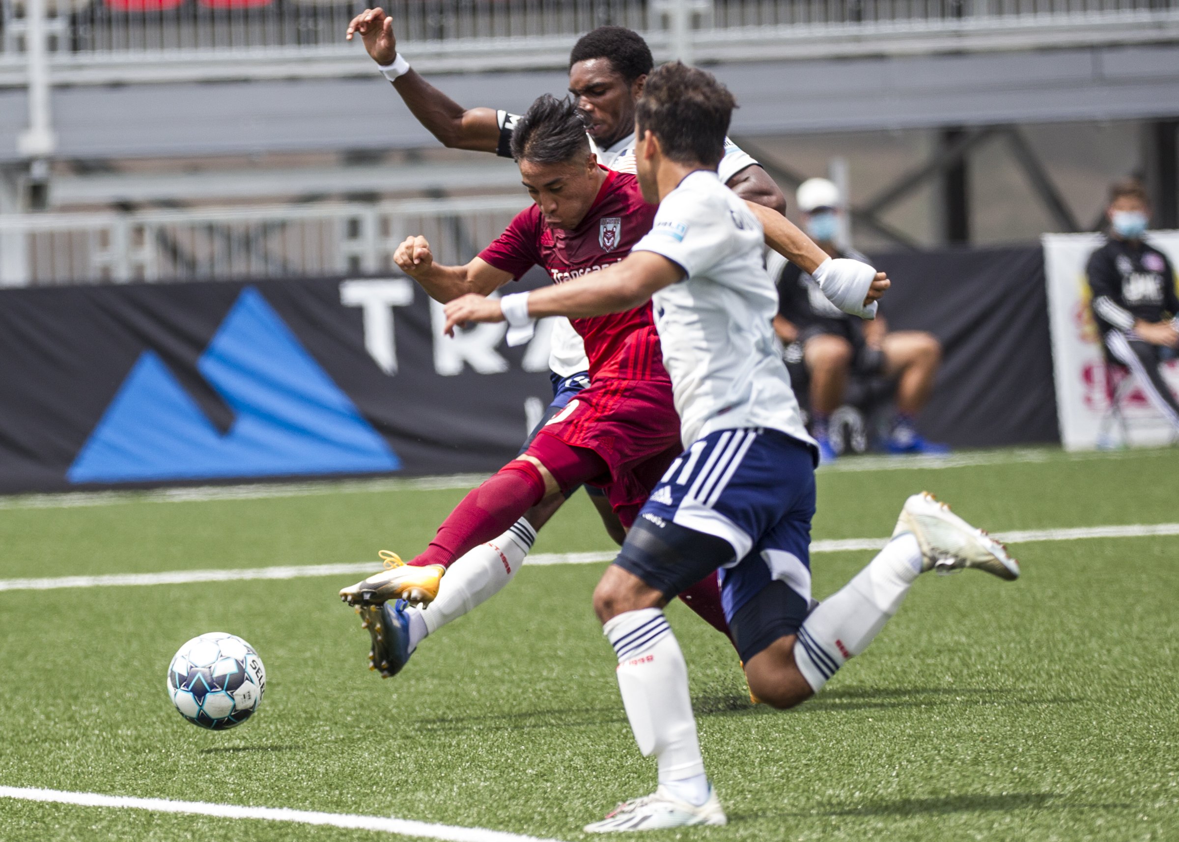Staff photo by Troy Stolt / Chattanooga forward Marky Hernandez, in red, scores during the Red Wolves' 4-0 victory against the New England Revolution II on Saturday at CHI Memorial Stadium in East Ridge. Greg Hurst assisted on the goal.