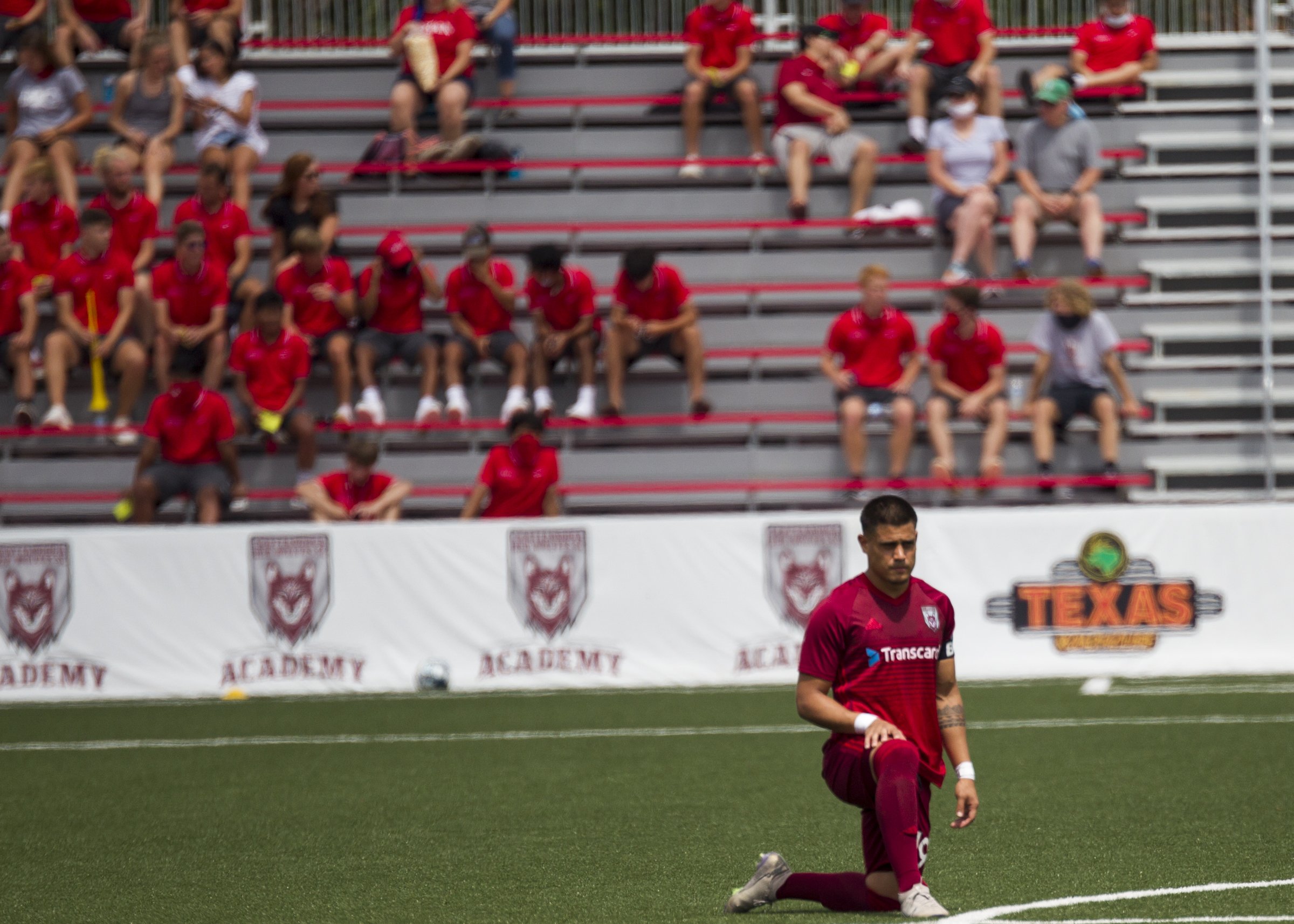 Staff photo by Troy Stolt / Chattanooga Red Wolves forward Ricardo Zacarias kneels on the field during a seven-minute moment of reflection regarding racial injustice before Saturday's USL League One match against the New England Revolution II at CHI Memorial Stadium in East Ridge. The Red Wolves won 4-0.