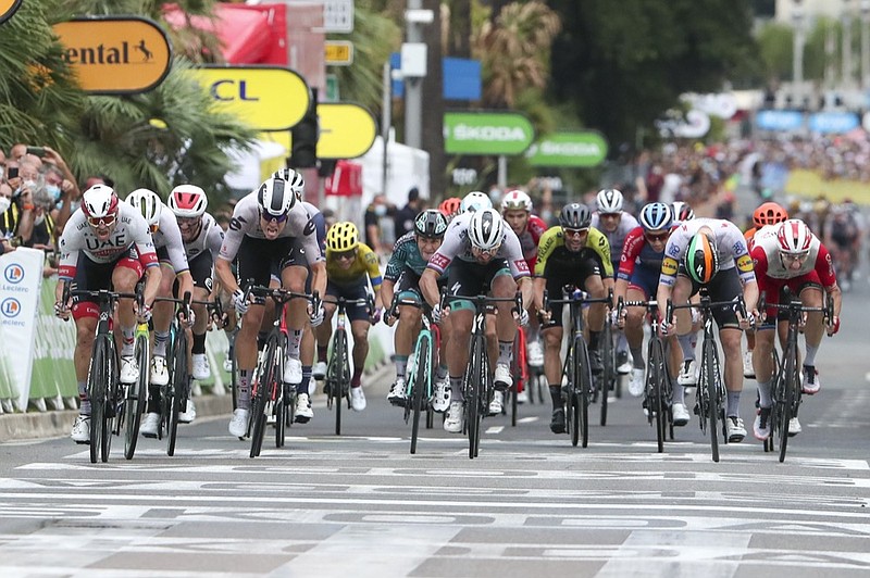 AP photo by Thibault Camus / Alexander Kristoff, left, sprints to the finish line to win the first stage of the Tour de France on Saturday in Nice.