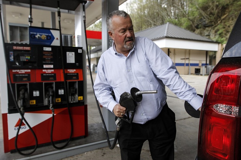 Staff photo by Doug Strickland / Richard Evans, who works as VP of Sales for Wirtgen America, fills up his gas tank at Citgo on Friday, April 3, 2015, off of Interstate 24 exit 169 in Dade County, Ga. Evans, who travels frequently between Nashville and his home in Georgia, said he is used to stopping at this exit because he believes the gas is cheaper, but it wouldn't make a difference to him if gas was a little more expensive. The Georgia legislature has passed a bill that will boost gas prices throughout the state, and Dade County is expected to be hurt worse than others.