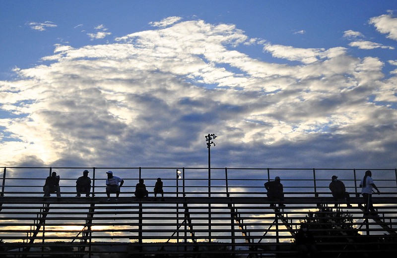 Brainerd fans social distance as the sun starts to set in the west.  The Brainerd Panthers visited the Hixson Wildcats in the first night of TSSAA football action on August 21, 2020. / Staff Photo by Robin Rudd 