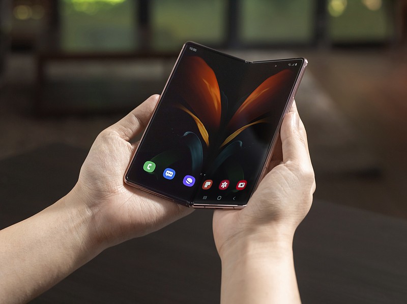 In this undated photo provided by Samsung, Samsung's foldable phone is displayed. Samsung's second attempt at a foldable smartphone will come with a $2,000 price tag and a few elite perks aimed at affluent consumers still able to afford the finer things in life during tough times. The phone, dubbed the Z Fold2, will include a VIP package that will provide access to fancy restaurants and golf clubs to supplement the device's multipurpose design. (Samsung via AP)