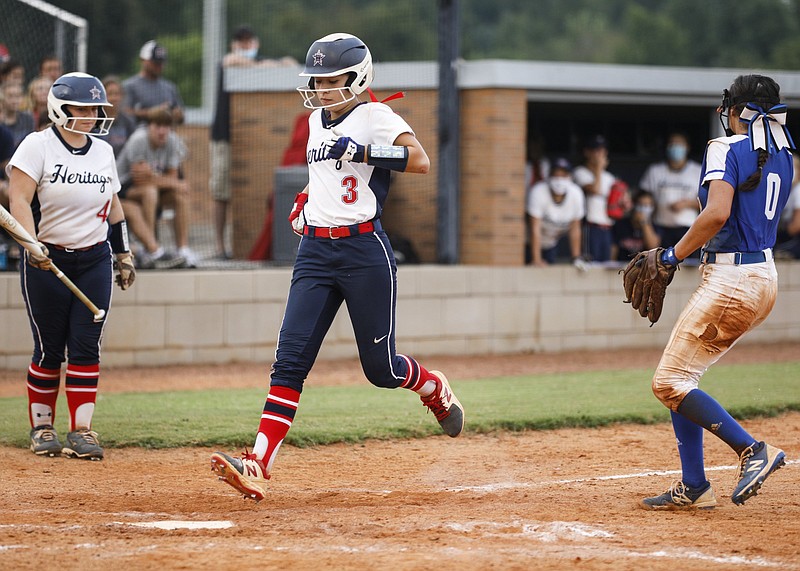 Staff photo by Troy Stolt / Heritage's Zoe Wright (3) scores a run during her team's softball game against Ringgold on Aug. 10.