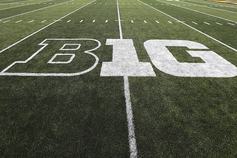 FILE - In this Aug. 31, 2019, file photo, the Big Ten logo is displayed on the field before an NCAA college football game between Iowa and Miami of Ohio in Iowa City, Iowa. Big Ten presidents voted 11-3 to postpone the football season until spring, bringing some clarity to a key question raised in a lawsuit brought by a group of Nebraska football players. The vote breakdown was revealed Monday, Aug. 31, 2020, in the Big Ten's court filing in response to the lawsuit. (AP Photo/Charlie Neibergall, File)