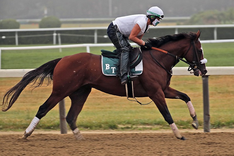 AP photo by Seth Wenig / Robin Smullen rides Tiz the Law during a June 19 workout at Belmont Park in Elmont, N.Y.