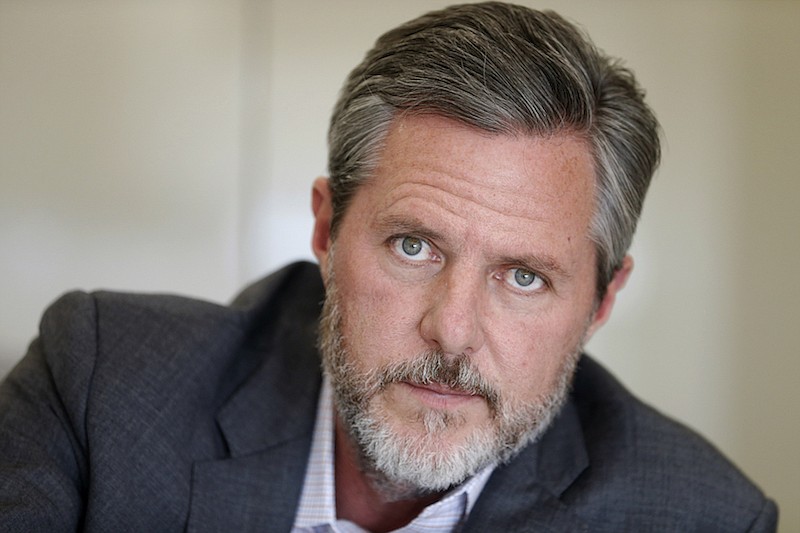 In this Nov. 16, 2016 file photo, Liberty University President Jerry Falwell Jr., pauses during an interview in his office at the school in Lynchburg, Va. On Tuesday, Aug. 25, 2020, Falwell said that he has submitted his resignation as head of evangelical Liberty University. (AP Photo/Steve Helber, File)