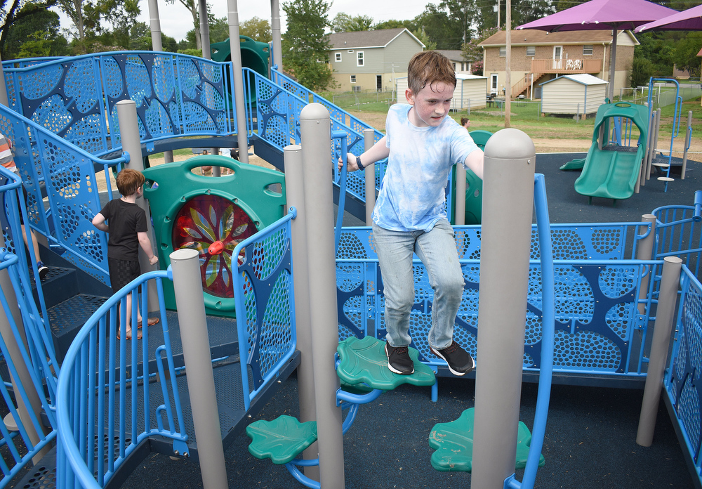 Staff photo by Matt Hamilton / Fort Oglethorpe resident Max Hughes, 11, plays on the new playground at Gilbert-Stephenson Park in Fort Oglethorpe.