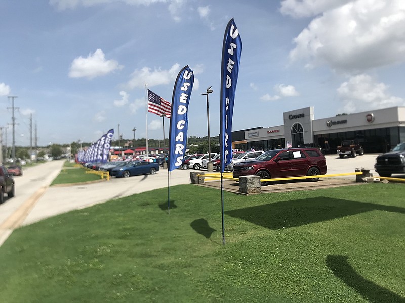 Photo by Dave Flessner / Used cars are offered for sale at Crown Chrysler dealership in Chattanooga