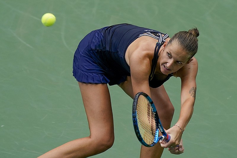 AP photo by Seth Wenig / Karolina Pliskova returns a shot to Caroline Garcia during their second-round match at the U.S. Open on Wednesday in New York.