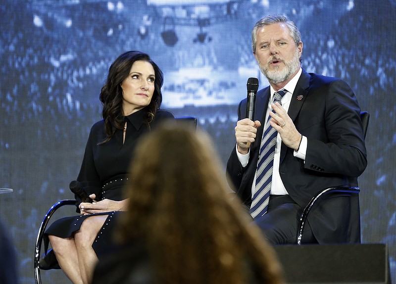 Photo by Steve Helber of The Associated Press / In this Nov. 28, 2018, file photo, Jerry Falwell Jr., right, answers a student's question accompanied by his wife, Becki, during after a town hall on the opioid crisis at a convocation at Liberty University in Lynchburg, Virginia. On Aug. 25, 2020, Falwell said that he has submitted his resignation as head of evangelical Liberty University.