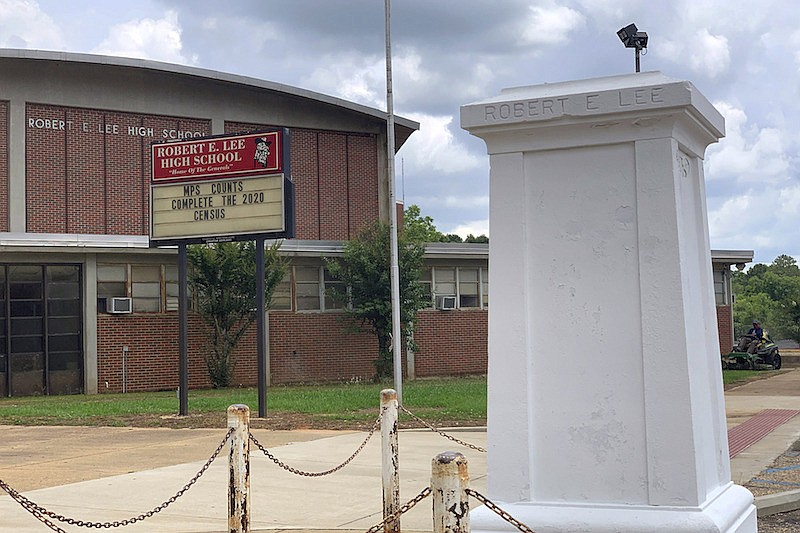 A pedestal that held a statue of Robert E. Lee stands empty outside a high school named for the Confederate general in Montgomery, Ala. on Tuesday, June 2, 2020. Four people were charged with criminal mischief after someone removed the statue amid nationwide protests over the police killing of George Floyd in Minnesota. (AP Photo/Kim Chandler)