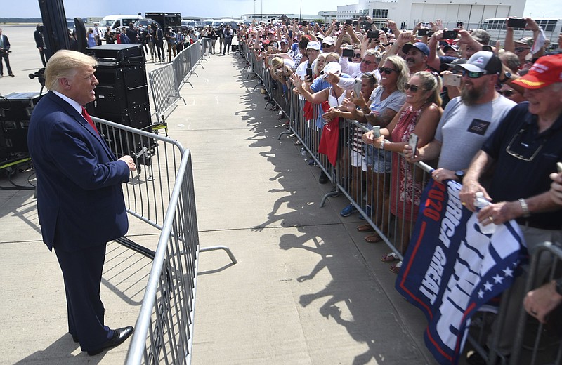 President Donald Trump talks to the crowd at Wilmington International Airport in Wilmington, N.C., Wednesday, Sept. 2, 2020. Trump was visiting Wilmington to declare it the first World War II Heritage City and to meet with World War II veterans in a private, invitation only event at the Battleship North Carolina. (Matt Born/The Star-News via AP)