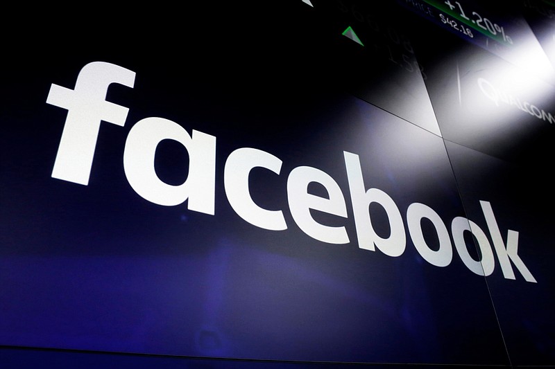 This March 29, 2018 file photo, shows the logo for social media giant Facebook at the Nasdaq MarketSite in New York's Times Square. With just two months left until the U.S. presidential election, Facebook says it is taking additional steps to encourage voting, minimize misinformation and reduce the likelihood of post-election "civil unrest." The company said Thursday, Sept. 3, 2020, it will restrict new political ads in the week before the election and remove posts that convey misinformation about COVID-19 and voting. (AP Photo/Richard Drew, File)