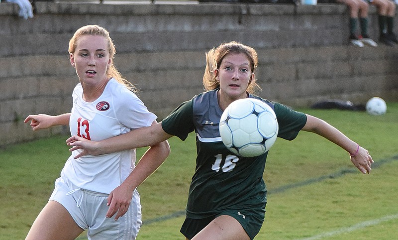 Staff photo by Matt Hamilton / Silverdale Baptist Academy's Alexa Barker, right, and Signal Mountain's Briley Lowry battle for the soccer ball during Thursday night's match at Silverdale.