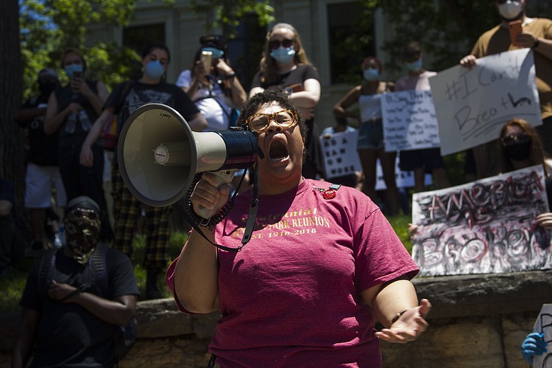 Staff photo by Troy Stolt / Chattanooga activist Marie Mott addresses the crowd during a protest outside of the Hamilton County Jail on Sunday, May 31, 2020 in Chattanooga, Tenn. Sunday was the second day of protests in Chattanooga over the murder of George Floyd by Minneapolis police officers.