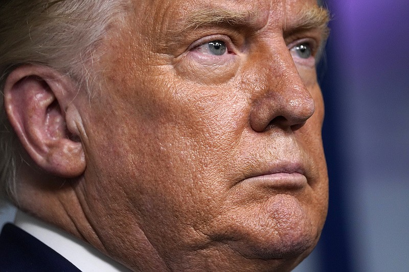 President Donald Trump listens during a news conference in the James Brady Press Briefing Room at the White House, Friday, Sept. 4, 2020, in Washington. (AP Photo/Evan Vucci)