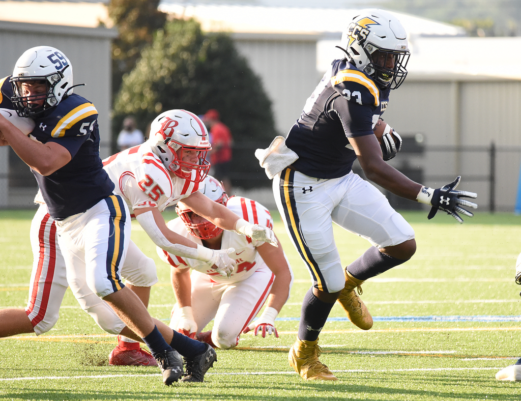 Staff Photo by Matt Hamilton / Chattanooga Christian School (23) Javoris Havis eludes Baylor defenders Friday.The Chattanooga Christian School Chargers hosted the Baylor School Red Raiders Friday.