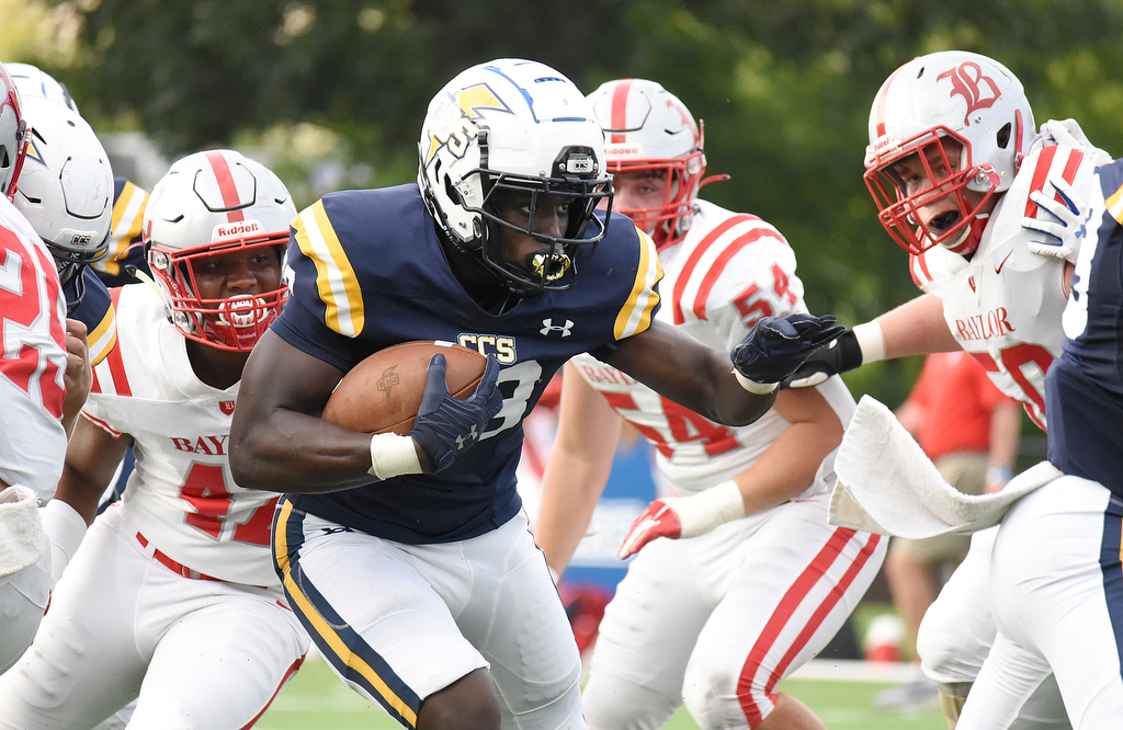 Staff Photo by Matt Hamilton / Chattanooga Christian School (28) Traveon Scott looks for daylight as Baylor defenders close in around him. The Chattanooga Christian School Chargers hosted the Baylor School Red Raiders Friday.