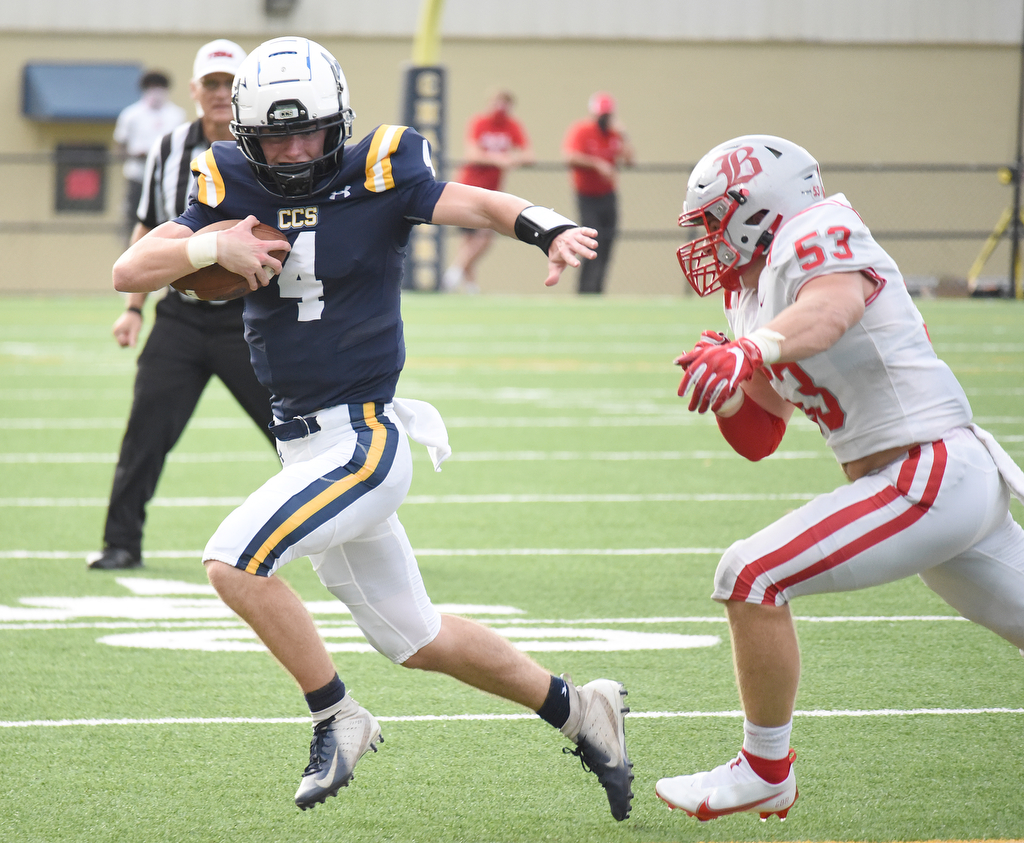 Staff Photo by Matt Hamilton / Baylor (53) Heath Snodgrass chases Chattanooga Christian (4) Sam Hall out of the pocket. The Chattanooga Christian School Chargers hosted the Baylor School Red Raiders Friday.