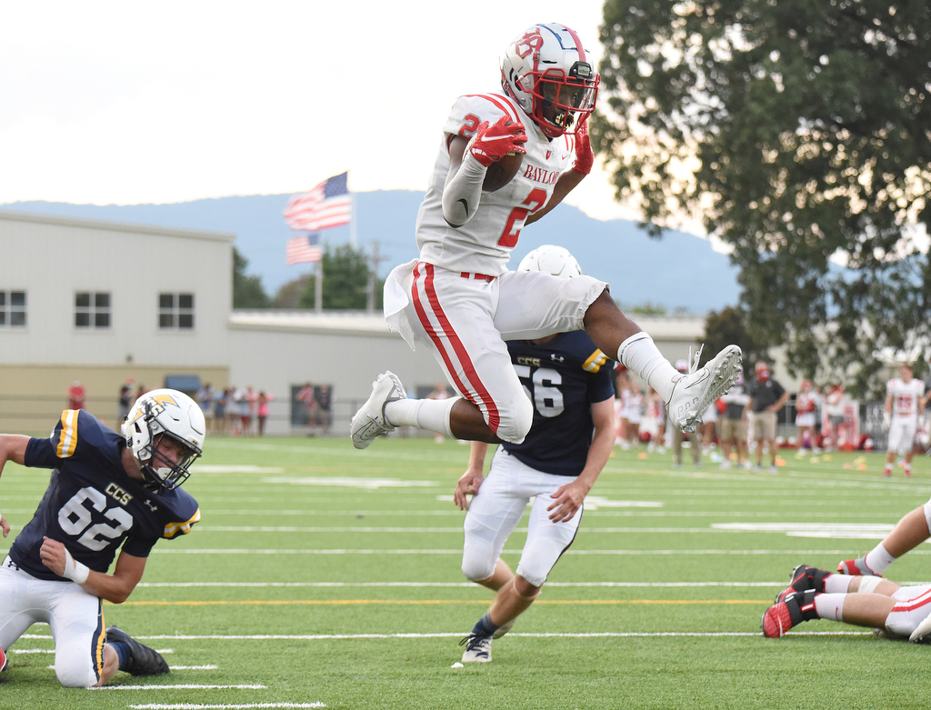 Staff Photo by Matt Hamilton / Baylor (2) Elijah Howard jumps into the end zone for a score. The Chattanooga Christian School Chargers hosted the Baylor School Red Raiders Friday.