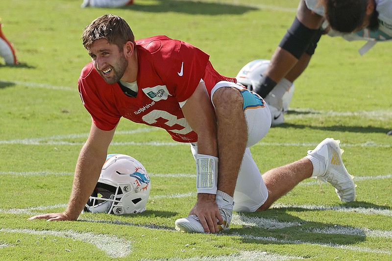 AP photo by Joel Auerbach / Josh Rosen stretches during the Miami Dolphins' training camp last Tuesday in Davie, Fla. The Dolphins released Rosen, their No. 3 quarterback on the depth chart, as part of their cuts Saturday to get the roster to 53 players before the season opener next Sunday.