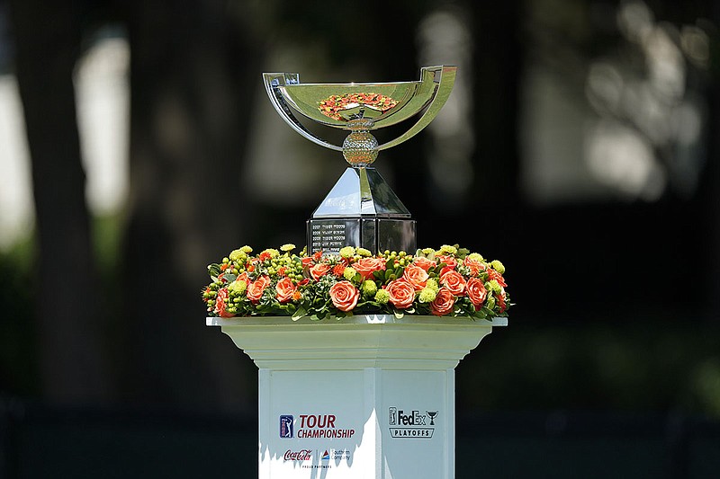 AP photo by John Bazemore / The Tour Championship trophy is displayed at the first hole at East Lake Golf Club during the third round of the Tour Championship on Sunday in Atlanta.