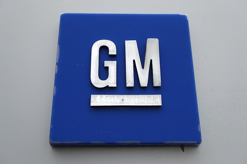 FILE - This Jan. 27, 2020, file photo shows a General Motors logo at the General Motors Detroit-Hamtramck Assembly plant in Hamtramck, Mich. General Motors is taking a $2 billion equity stake in Nikola that will see it engineer and make the company's Badger, a fully-electric and hydrogen fuel cell electric pickup truck. (AP Photo/Paul Sancya, File)