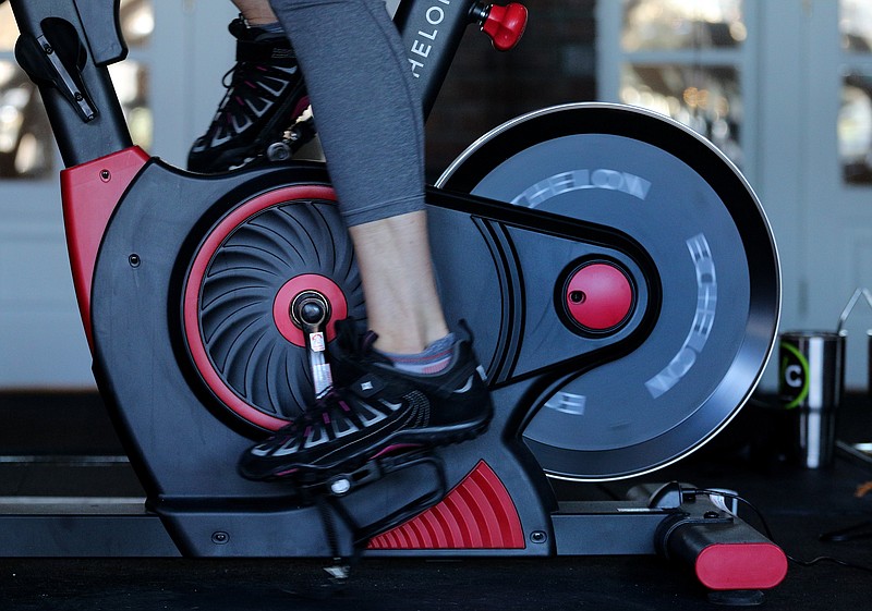 Staff file photo / An instructor leads a class in a spin studio in the Chattanooga Choo Choo last year.