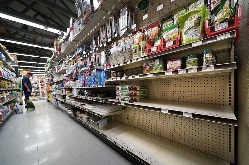 Shelves that are usually stocks with Mason jars and lids in the canning supply section are mostly empty at the Drillin True Value hardware store, Friday, Sept. 4, 2020, in South Portland, Maine. During this ongoing coronavirus pandemic many retailers have been frustrated by the scarce supply of jars and lids used for canning vegetables. (AP Photo/Robert F. Bukaty)