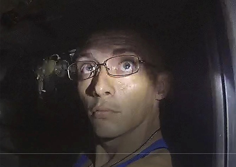 In this image, released by the Georgia Bureau of Investigation, taken from a deputy's body camera, Texas fugitive Dalton Potter is questioned during a traffic stop on Monday, Sept. 7, 2020, in Dalton, Ga. A GBI statement released Tuesday, Sept. 8, said one of two Texas fugitives wanted after a Georgia deputy was shot during the traffic stop, Jonathan Hosmer, has been apprehended, while Potter remains at large. (Georgia Bureau of Investigation via AP)


