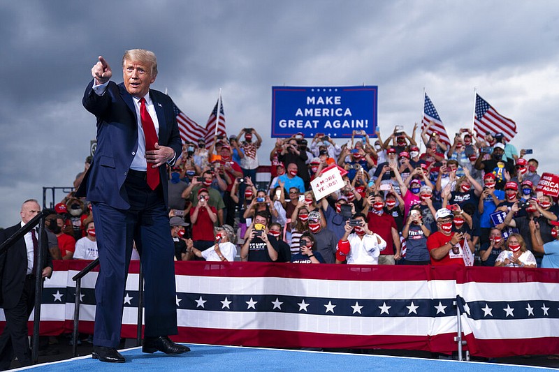 President Donald Trump arrives to speak at a campaign rally at Smith Reynolds Airport, Tuesday, Sept. 8, 2020, in Winston-Salem, N.C. (AP Photo/Evan Vucci)