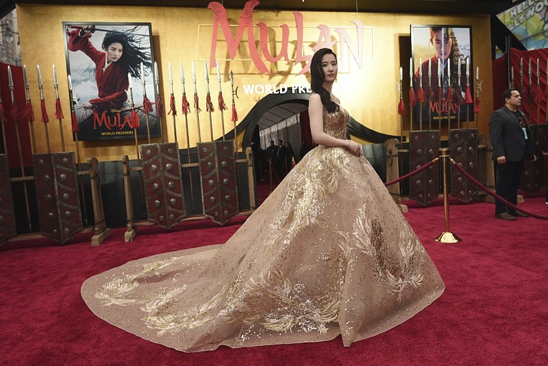 FILE - In this March 9, 2020, file photo, Yifei Liu, star of the new live-action "Mulan," poses at the premiere of the film at the El Capitan Theatre in Los Angeles. Disney is under fire for filming part of its live-action reboot "Mulan" in Xinjiang, the region in China where the government has been accused of human rights abuses against Uighurs and other predominantly Muslim minorities. (AP Photo/Chris Pizzello, File)


