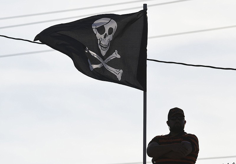 Staff photo by Robin Rudd / With the Jolly Roger flying behind him, a South Pittsburg football waits for the start of the Pirates' rivalry matchup against visiting Marion County in September 2018.