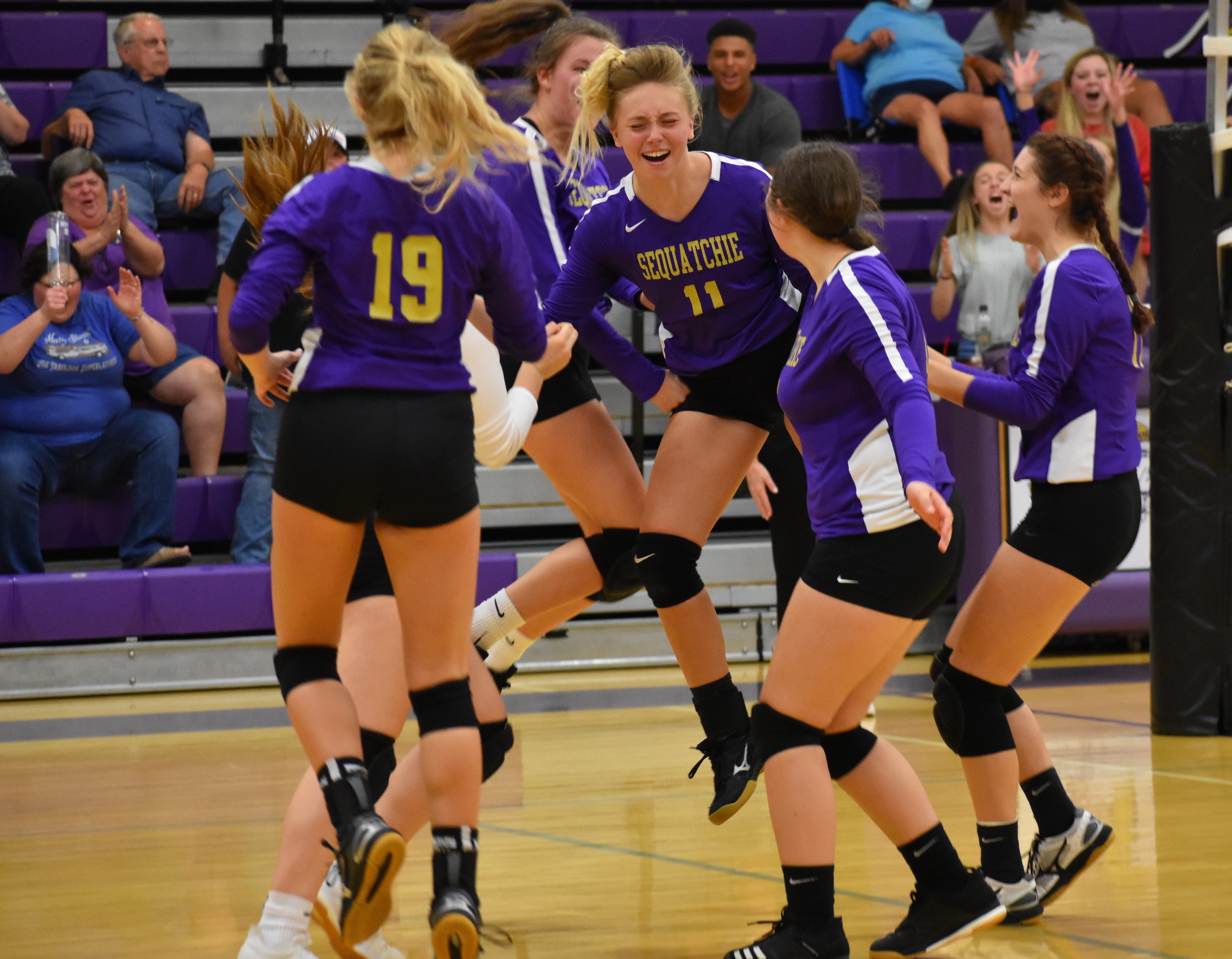 Staff photo by Patrick MacCoon / The Sequatchie County volleyball team celebrates after scoring the final point at home in a district match against Red Bank on Thursday.