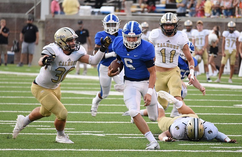 Staff photo by Matt Hamilton / McCallie's Austin Breedlove rambles through Calhoun's defense during Friday night's matchup at Finley Stadium.