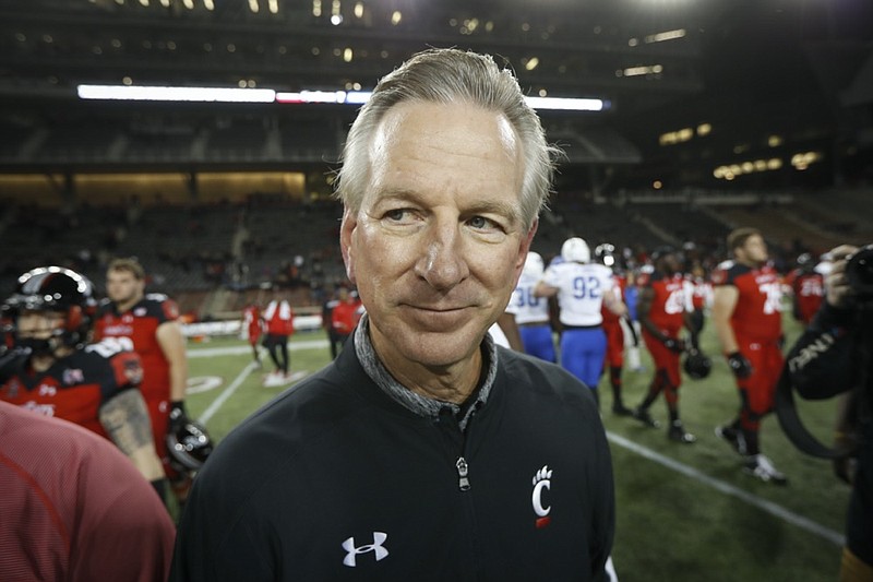 FILE - In this Nov. 18, 2016 file photo, Cincinnati coach Tommy Tuberville walks off the field after the team's NCAA college football game against Memphis in Cincinnati. Democratic Sen. Doug Jones of Alabama has called Republican challenger Tommy Tuberville "Coach Clueless" for the former football coach's recent comments about the coronavirus. Jones attacked Tuberville in a campaign appearance Friday, Sept. 11, 2020. (AP Photo/John Minchillo, File)


