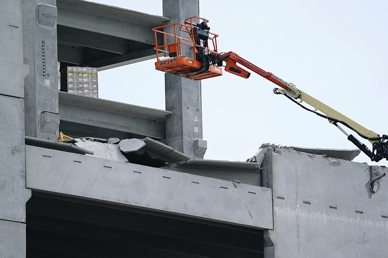 FILE - In this Sept. 11, 2020 photo, damage is seen to a parking deck under construction after it partially collapsed, injuring several workers in Atlanta. The parking deck under construction has collapsed for a second time in as many days. Atlanta Fire Rescue said Saturday, Sept. 12, that fire units were deployed to the building in the city's Midtown section for "a second major collapse" of the parking deck that partially fell Friday. (AP Photo/Elijah Nouvelage, File)


