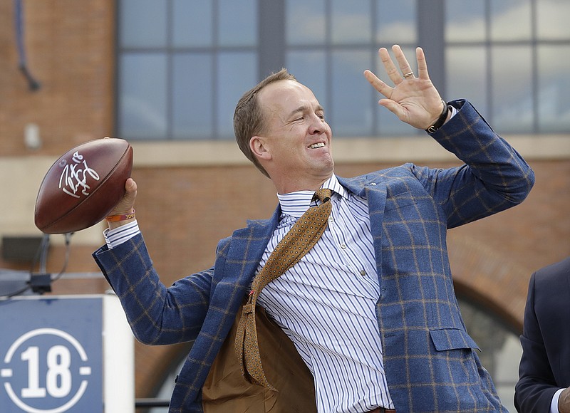 AP file photo by Darron Cummings / Former University of Tennessee and NFL quarterback Peyton Manning's generosity via multiple charitable acts has been a hallmark of his retirement, but his philanthrophy started even before he played his final game.