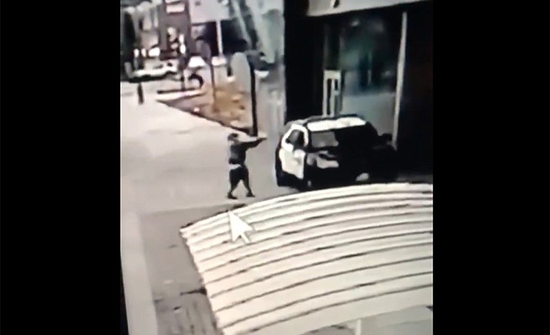 A screen grab from a security camera video released the Los Angeles County Sheriff's Department shows a gunman walking up to sheriff's deputies and opening fire without warning or provocation in Compton, Calif., on Saturday, Sept. 12, 2020. Officials say two Los Angeles County sheriff's deputies were shot in their patrol car at a Metro rail station in what appeared to be an ambush. The sheriff's department said the male and female deputies were shot in the head and had multiple gunshot wounds and were undergoing surgery. Deputies were searching for a suspect. (Los Angeles County Sheriff's Department via AP)