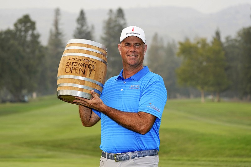 AP photo by Eric Rosberg / Stewart Cink poses with his trophy on the 18th green of the Silverado Resort North Course after winning the PGA Tour's Safeway Open on Sunday in Napa, Calif.