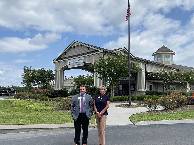 Contributed photo from Morning Pointe / Morning Pointe of Chattanooga executive director Cody Harvey, left, and community relations director Emily Thibodeau stand in front of the renovated Morning Pointe of Chattanooga building on Shallowford Road.