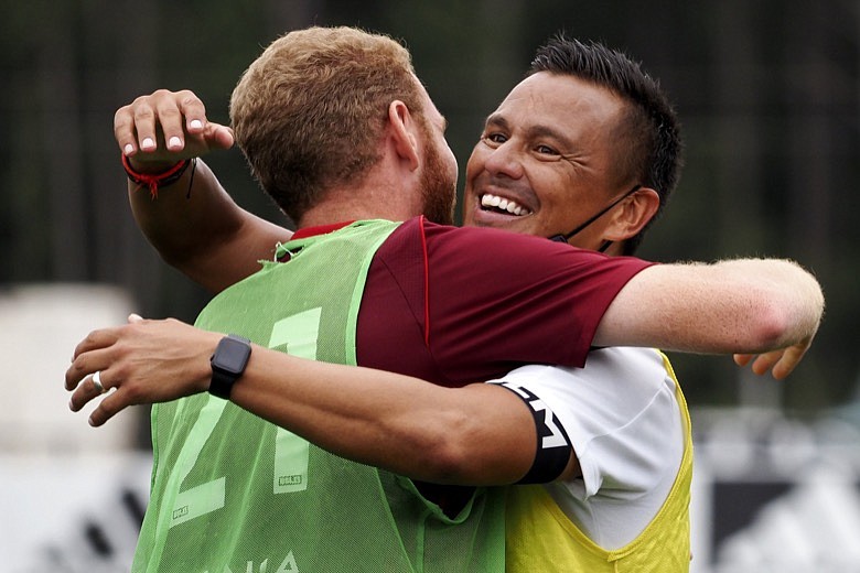 Staff photo by C.B. Schmelter / Red Wolves SC head coach Jimmy Obleda, right, hugs midfielder Tanner Dieterich after the team beat Union Omaha during a USL League One match on Sept. 15, 2020, at CHI Memorial Stadium in East Ridge.