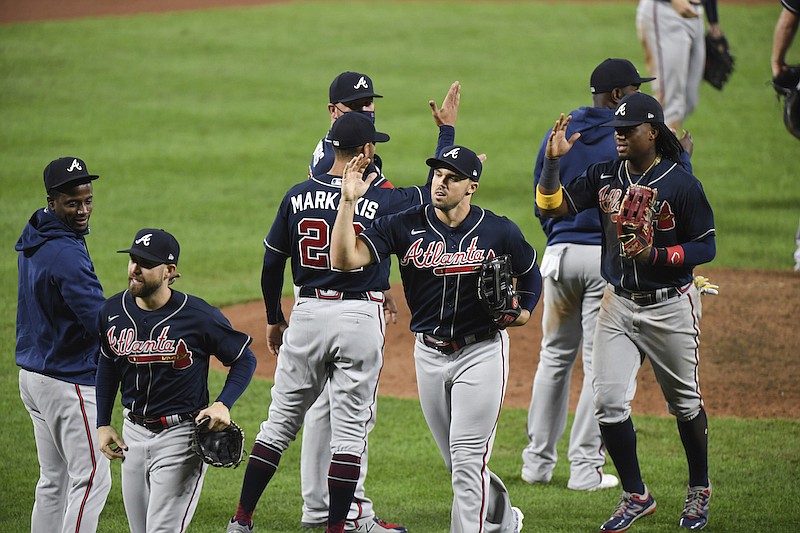 The Atlanta Braves celebrate a 5-1 win against the Baltimore Orioles in a baseball game Tuesday, Sept. 15, 2020, in Baltimore. (AP Photo/Terrance Williams)